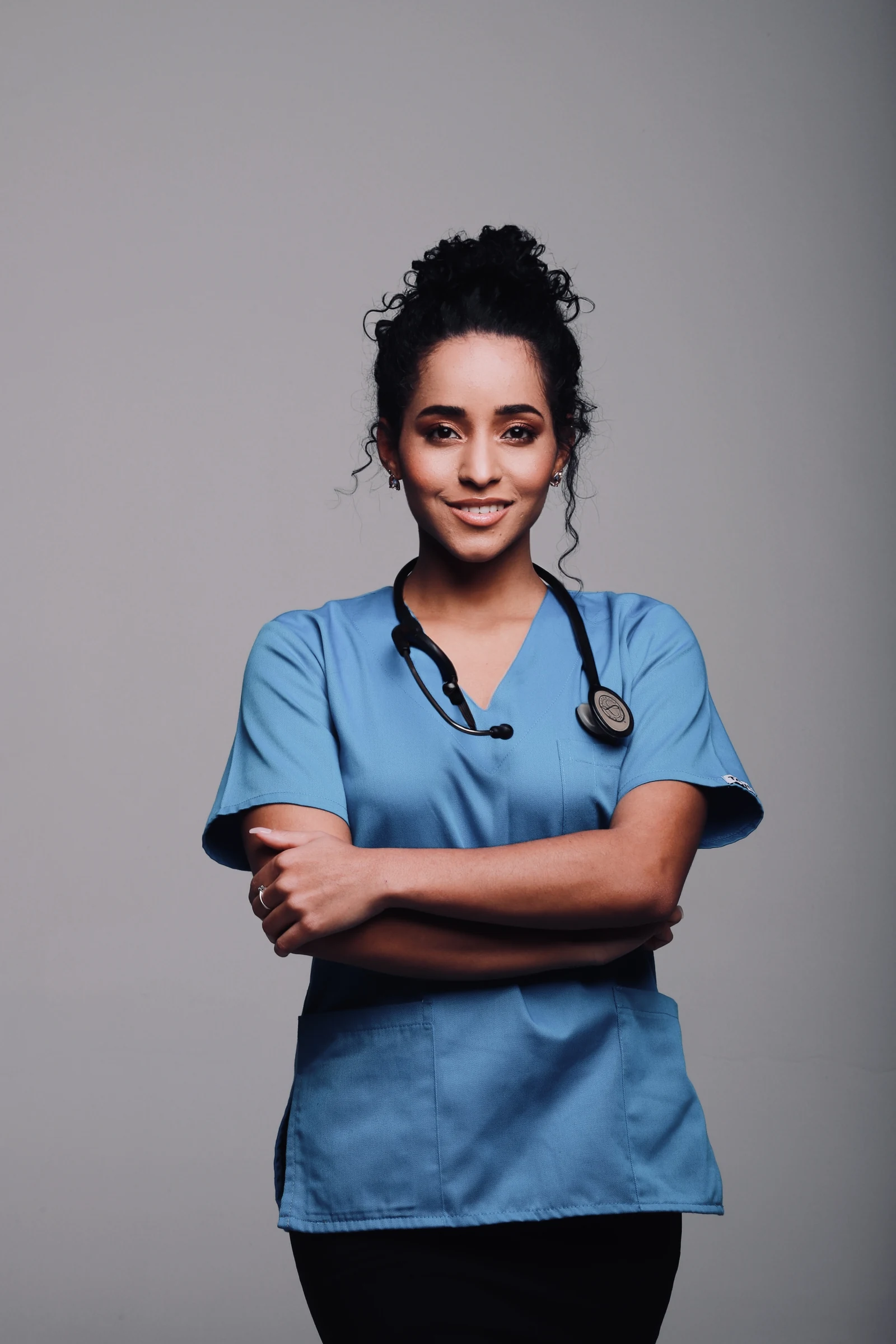 Dr Bello Alvarez in blue medical scrubs
